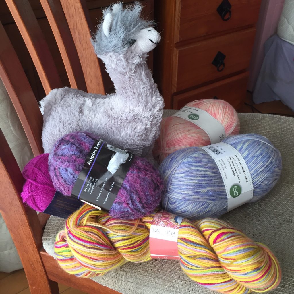 Balls of wool and an alpaca